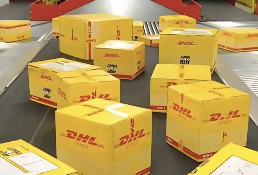 DHL Express packages on the Guangzhou conveyor sorting belt. Daily rep bag dispatch batch to US, UK, EU